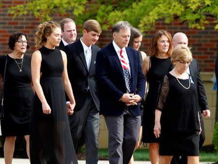 The family of Otto Warmbier follow his casket to the hearse after his funeral service at Wyoming High School in Wyoming, Ohio. REUTERS/John Sommers II