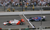 FILE - In this May 28, 2006, file photo, Sam Hornish Jr., left, pumps his fist as he beats Marco Andretti to the finish line to win the Indianapolis 500 auto race at Indianapolis Motor Speedway in Indianapolis. The Associated Press has updated its survey of living Indianapolis 500 winners and their pick as the greatest race in the long history of the event. There are six races that received multiple votes, topped by Al Unser Jr.’s victory over Scott Goodyear in 1992 — the closest Indy 500 in history. The others are Emerson Fittipaldi's win in 1989; Hornish's win in 2006; the 1982 battle between Rick Mears and Gordon Johncock; the 2011 race won by the late Dan Wheldon; and the 2014 thriller won by Ryan Hunter-Reay. (AP Photo/Dave Parker, File)