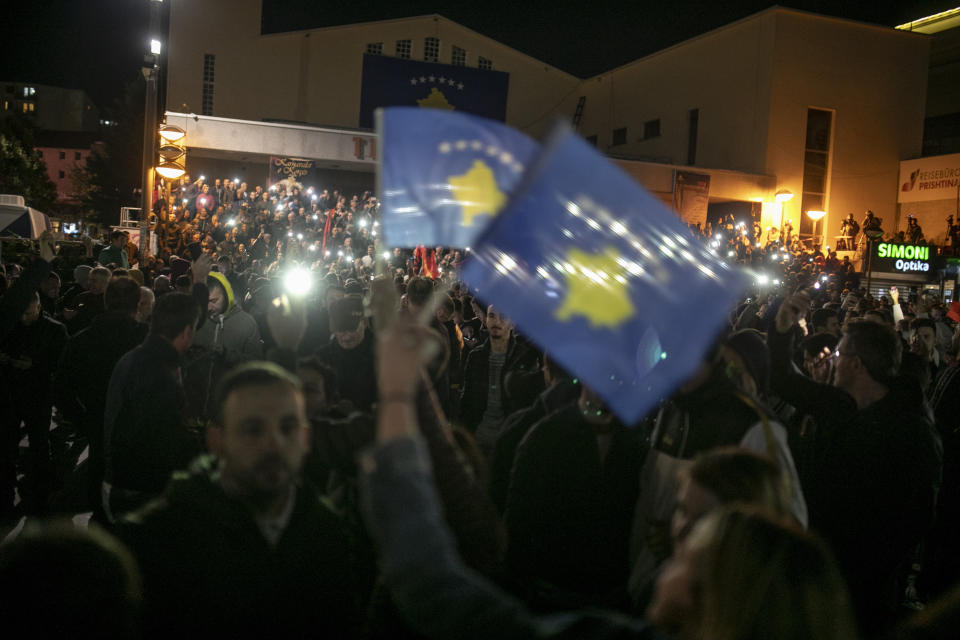 Supporters of Albin Kurti, leader of Self-Determination Movement (Vetevendosje) celebrate after the initial results in the parliamentary elections in Kosovo capital Pristina early Monday, Oct. 7, 2019. Two Kosovo opposition parties emerged as the top-vote getters in Sunday's snap election of a new parliament held amid calls for leaders to resume dialogue with Serbia over normalizing ties. Self-Determination supporters took to the streets to celebrate. (AP Photo/Visar Kryeziu)