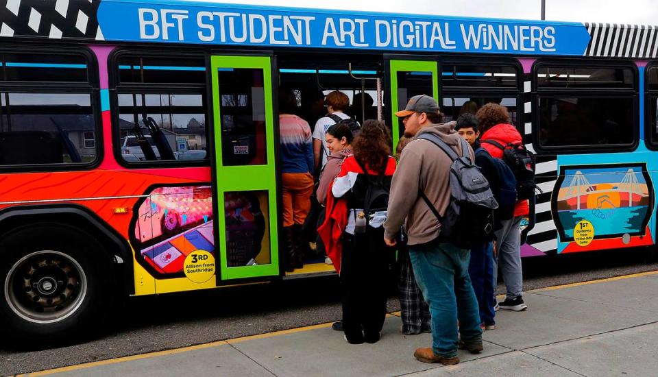 River View High School students board the Ben Franklin Transit art bus to see the 20 winners, the top ten from each of two categories, that are displayed in the inside of the coach. The top three winners for both the digital and traditional categories are displayed on the exterior and will be visible on the roads around the Tri-Cities for a ful year.