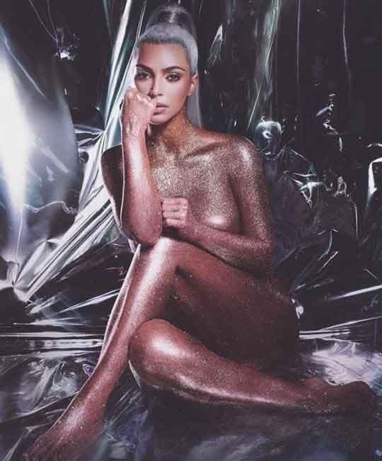 Kim Kardashian glistens in gold glitter for a KKW beauty photo shoot. Source: KKW Beauty / Instagram