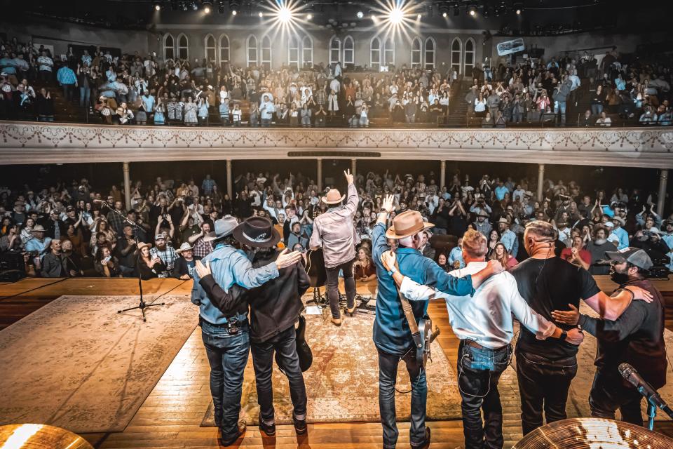 Randy Rogers band receiving a standing ovation at the end of their performance at the Ryman Auditorium