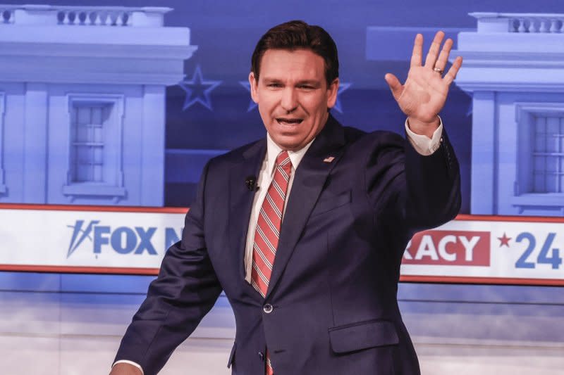 Florida Gov. Ron DeSantis waves as he arrives to participate in a Fox News Town Hall event at the Iowa Events Center in Des Moines, Iowa, on Tuesday. DeSantis and other Republican candidates are appealing to Iowa Republican voters who will gather to caucus on January 15 to select their candidate for president. Photo by Tannen Maury/UPI