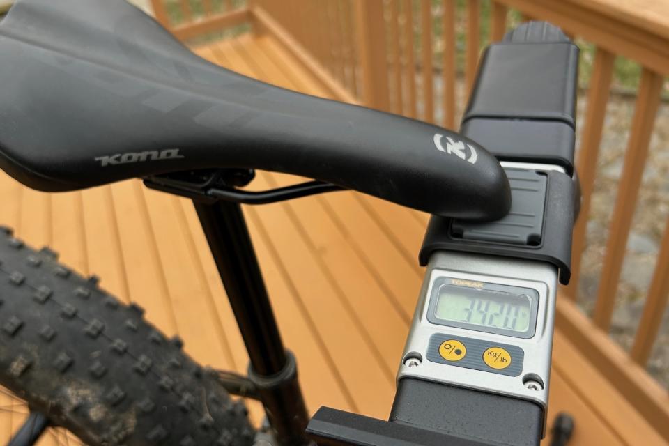 Weighing a Kona fat bike on the integrated scale of the ToPeak Prepstand Pro bike repair stand