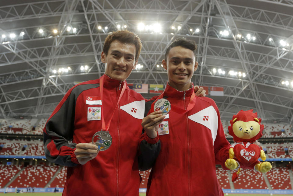 Zac Leow (left) winning the 2015 ASEAN Para Games men's 1,500m (T37) silver medal at the Singapore National Stadium, alongside compatriot Suhairi Suhani who earned a silver in the men's long jump (F20) event. 
