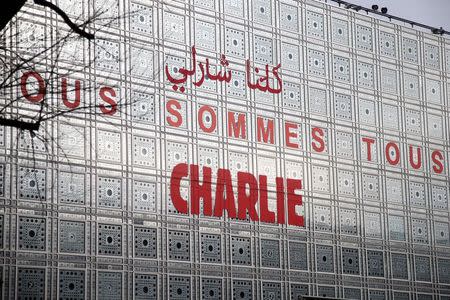 The Arab Institute building bears the message 'We are all Charlie', to pay tribute to the journalists and police who were killed in an Islamist attack January 7, 2015 at the offices of the satirical weekly Charlie Hebdo in Paris January 20, 2015. REUTERS/Charles Platiau