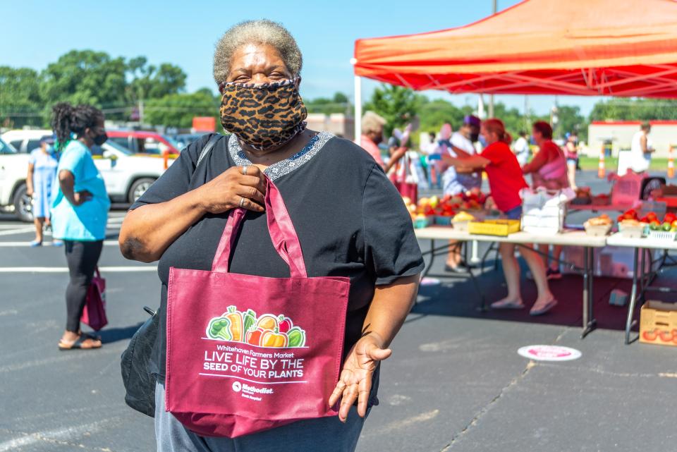 A customer poses for a photo at the 2020 Whitehaven Farmers Market.  This neighborhood market is hosted by Methodist South Hospital.