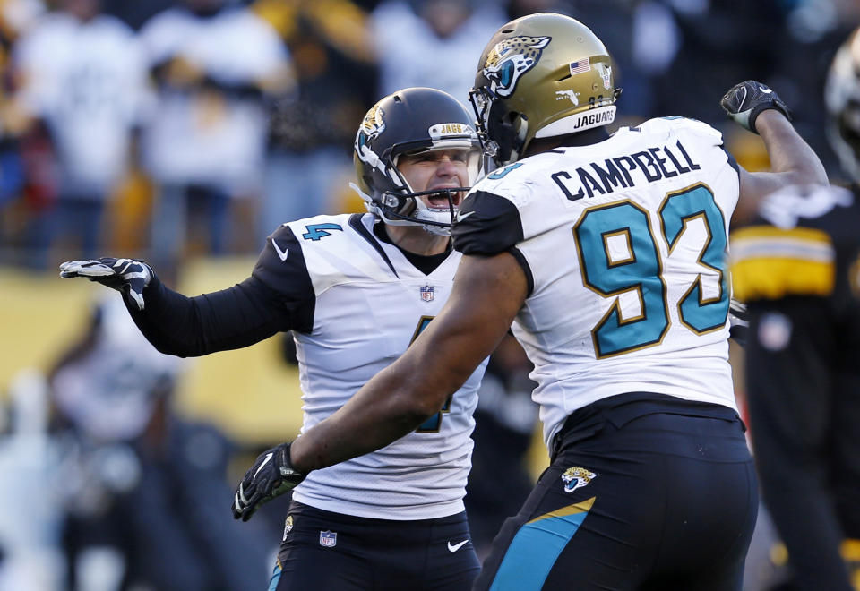 Calais Campbell (right) congratulates kicker Josh Lambo during Sunday’s divisional playoff against the Steelers. (AP)