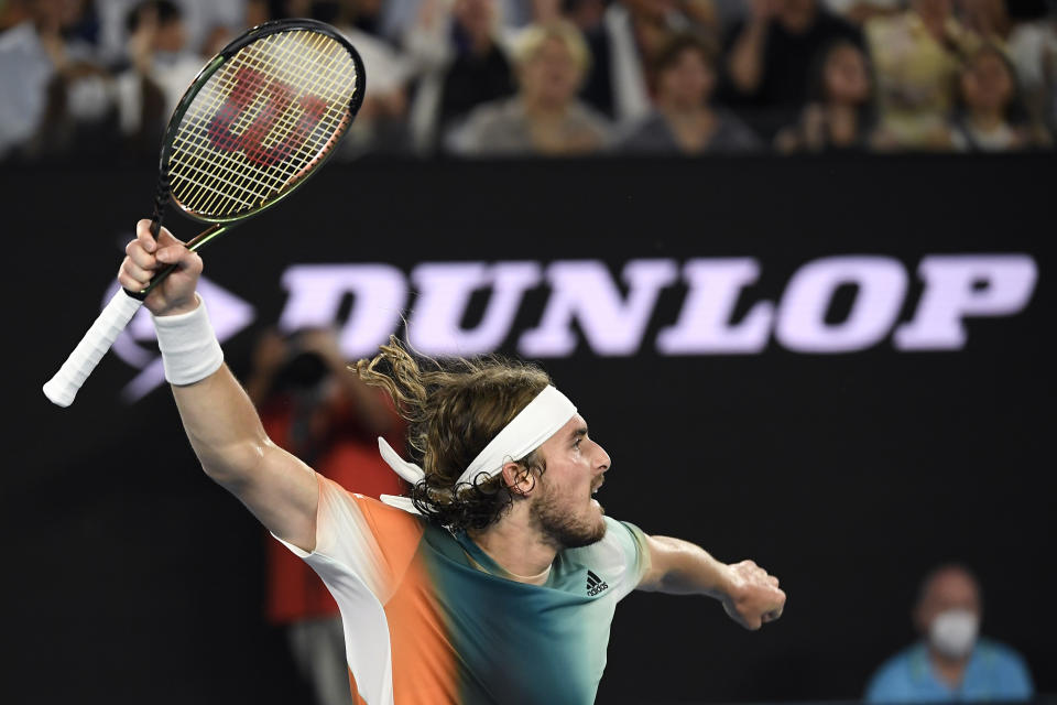 Stefanos Tsitsipas of Greece reacts after winning the second set against Daniil Medvedev of Russia during their semifinal match at the Australian Open tennis championships in Melbourne, Australia, Friday, Jan. 28, 2022. (AP Photo/Andy Brownbill)