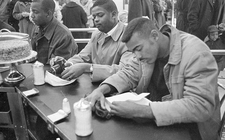 <span class="caption">Civil rights protesters at a sit-in, North Carolina, 1960.</span> <span class="attribution"><a class="link " href="https://upload.wikimedia.org/wikipedia/commons/5/5f/Civil_Rights_protesters_and_Woolworth%27s_Sit-In%2C_Durham%2C_NC%2C_10_February_1960._From_the_N%26O_Negative_Collection%2C_State_Archives_of_North_Carolina%2C_Raleigh%2C_NC._Photos_taken_by_The_News_%26_%2824495308926%29.jpg" rel="nofollow noopener" target="_blank" data-ylk="slk:State Archives of North Carolina/Wikimedia Commons.;elm:context_link;itc:0;sec:content-canvas">State Archives of North Carolina/Wikimedia Commons.</a></span>