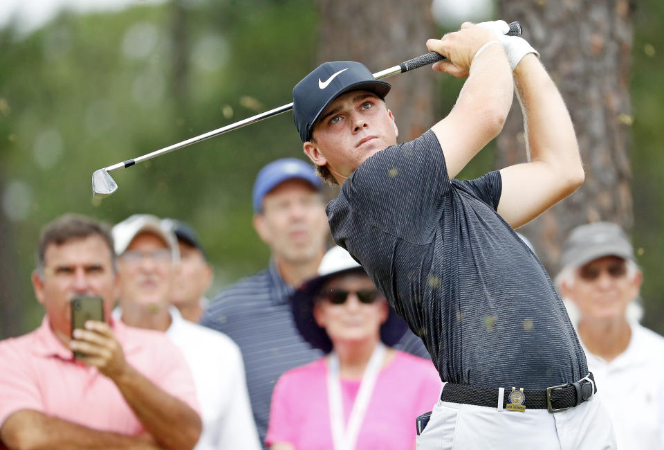 John Augenstein hits off the tee on the eighth hole during the final round against Andy Ogletree at the USGA Amateur Golf Championship at the Pinehurst Country Club , in Pinehurst, N.C, Sunday, Aug. 18, 2019, (AP Photo/Karl B DeBlaker)