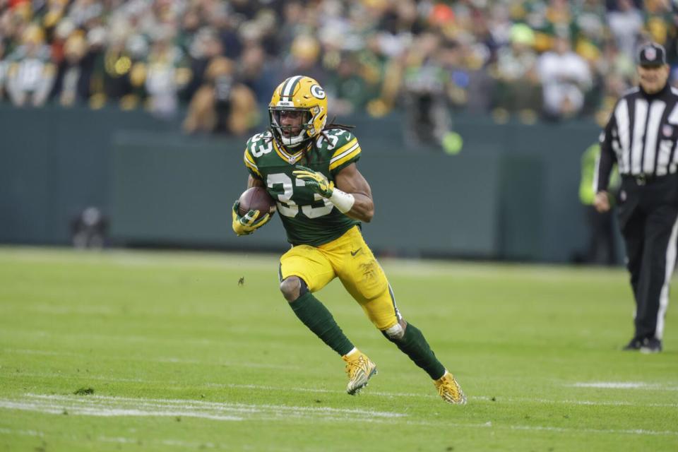 Green Bay Packers running back Aaron Jones (33) runs in open field against the Chicago Bears.