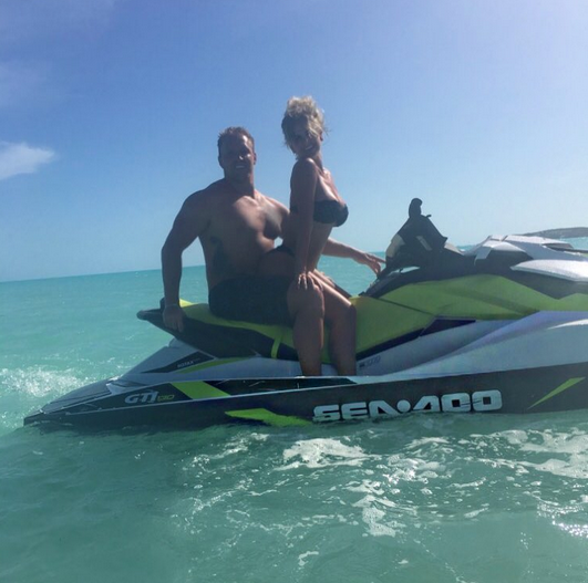<p>Kim captioned this pic of her and Kroy, 31, perched on a jet ski with a simple red-heart emoji. They really do seem to be in love. (Photo: <a rel="nofollow noopener" href="https://www.instagram.com/p/BVFGWJBhg8d/" target="_blank" data-ylk="slk:Kim Zolciak-Biermann via Instagram" class="link ">Kim Zolciak-Biermann via Instagram</a>) </p>