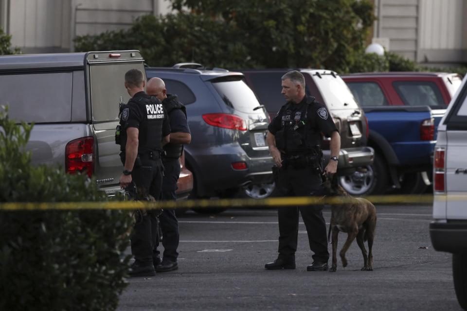 Investigators searched an apartment Thursday evening where the suspected gunman lived with his mother about two miles from Umpqua Community College. (Steve Dipaola/Reuters)