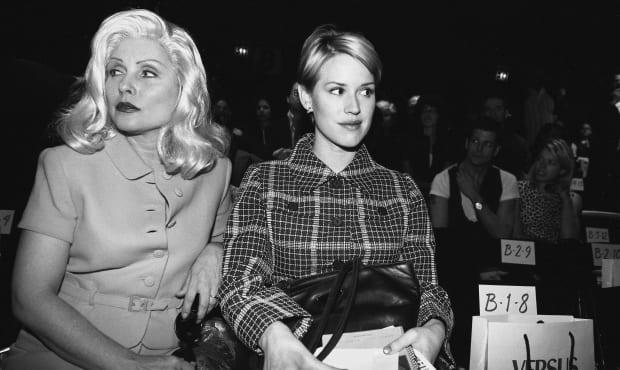 NEW YORK - MARCH 27: Deborah Harry (L) and Molly Ringwald (R) at Versace Versus fashion show on March 27, 1996 in New York City, New York. (Photo by Catherine McGann/Getty Images) <p><a href="https://www.gettyimages.com/detail/120341952" rel="nofollow noopener" target="_blank" data-ylk="slk:Catherine McGann/Getty Images;elm:context_link;itc:0;sec:content-canvas" class="link ">Catherine McGann/Getty Images</a></p>