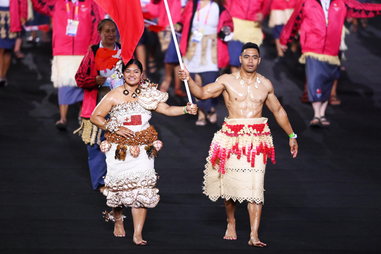 Flag bearers of Team Tonga, pictured here leading their team during the opening ceremony of the Commonwealth Games.