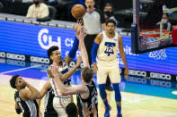 Philadelphia 76ers' Danny Green, second from front left, goes up to shoot over San Antonio Spurs' Jakob Poeltl, front right, during the first half of an NBA basketball game, Sunday, March 14, 2021, in Philadelphia. (AP Photo/Chris Szagola)