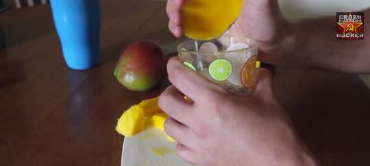 One cup. One mango. Nothing wasted. (The lip of the glass serves as a makeshift knife.) You're going to want to <a href="http://www.huffingtonpost.com/2014/07/16/how-to-peel-a-mango_n_5588886.html" target="_blank">master this hack</a>. 