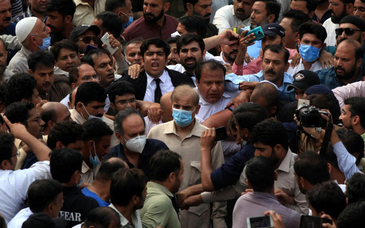 Shehbaz Sharif, brother of former Prime Minister Nawaz Sharif and leader of Pakistan Muslim League-Nawaz (PML-N), walks with lawyers and supporters after the High Court rejected bail plea in money laundering case in Lahore, Pakistan September 28, 2020. REUTERS/Mohsin Raza