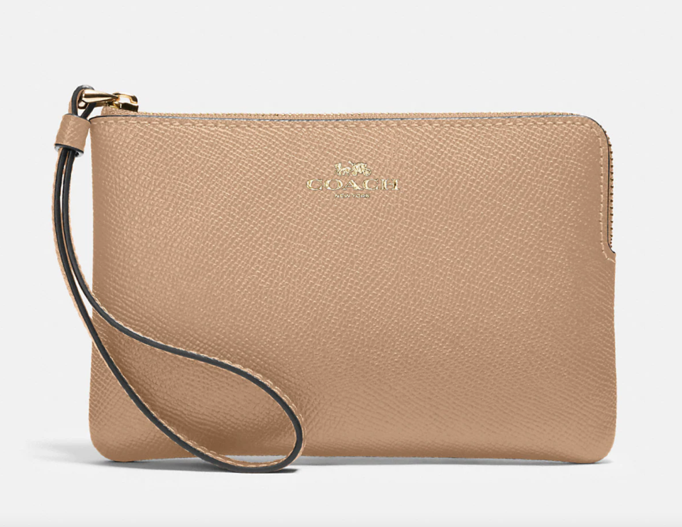 Corner Zip Wristlet in light tan brown (Photo via Coach Outlet)