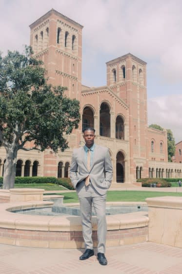 Former UCLA football player Elijah Wade poses for a photo.