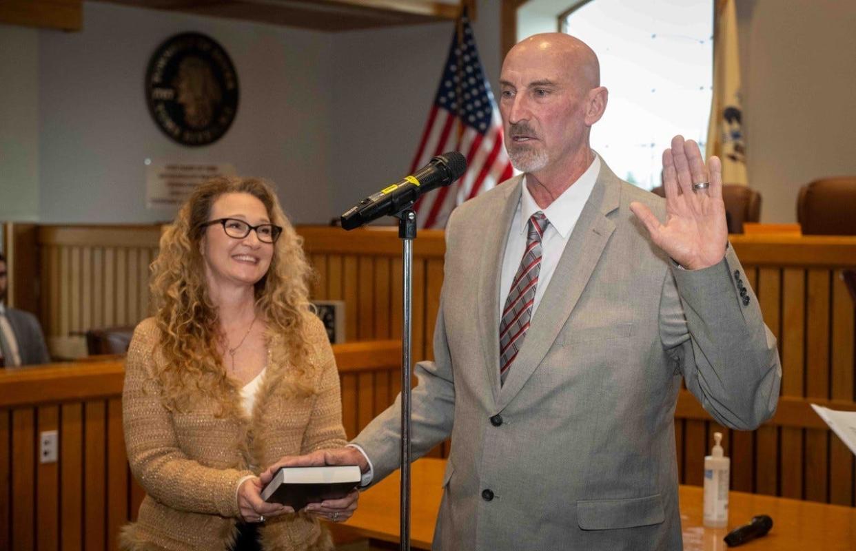 Thomas A. Nivison takes the oath of office as a Toms River Township Councilman as his wife, Dawn, holds the Bible. Jan. 1, 2024