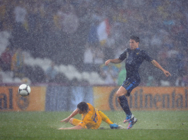 TOPSHOTS French midfielder Samir Nasri (R) vies with Ukrainian defender Vyacheslav Shevchuk during the Euro 2012 championships football match Ukraine vs France on June 15, 2012 at the Donbass Arena in Donetsk. AFP PHOTO / PATRICK HERTZOGPATRICK HERTZOG/AFP/GettyImages