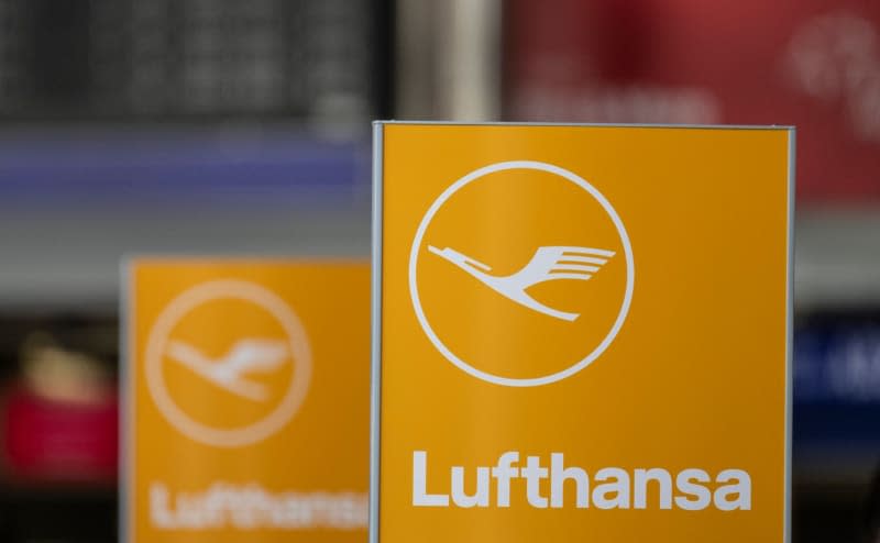 The Lufthansa logo can be seen on a sign in Terminal 1 of Frankfurt airport. Boris Roessler/dpa