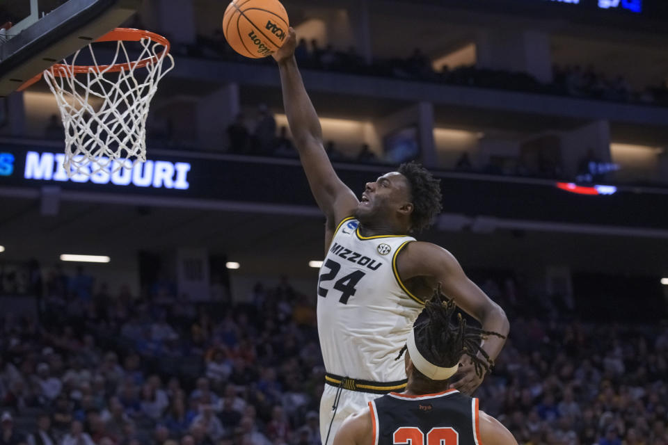 Missouri guard Kobe Brown (24) shoots over Princeton forward Tosan Evbuomwan during the first half of a second-round college basketball game in the men's NCAA Tournament in Sacramento, Calif., Saturday, March 18, 2023. (AP Photo/Randall Benton)