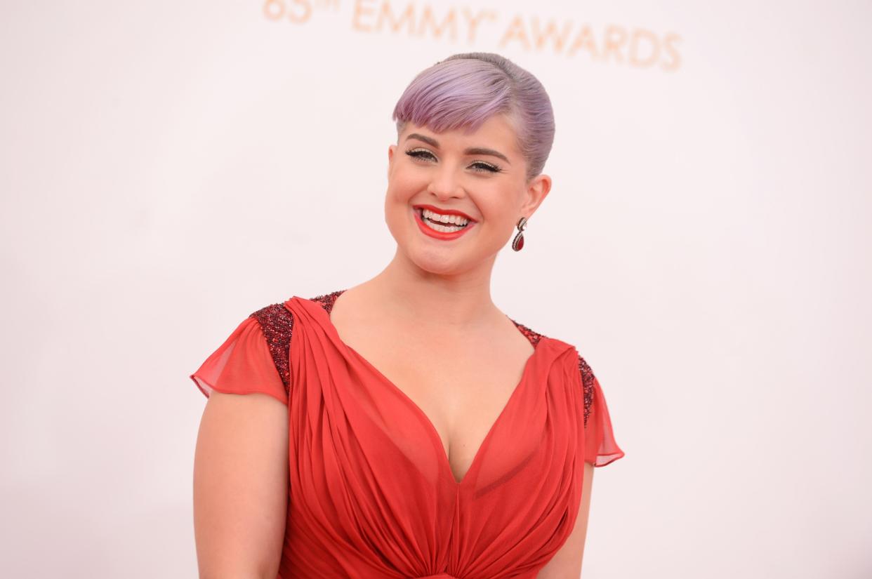 Kelly Osbourne arrives at the 65th Primetime Emmy Awards at Nokia Theatre on Sunday Sept. 22, 2013, in Los Angeles.  (Photo by Jordan Strauss/Invision/AP)