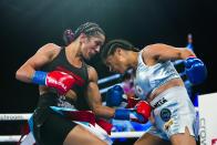 Puerto Rico's Amanda Serran, left, punches Mexico's Erika Cruz Hernandez during the second round of a women's featherweight championship boxing bout Saturday, Feb. 4, 2023 in New York. Serrano won the fight. (AP Photo/Frank Franklin II)