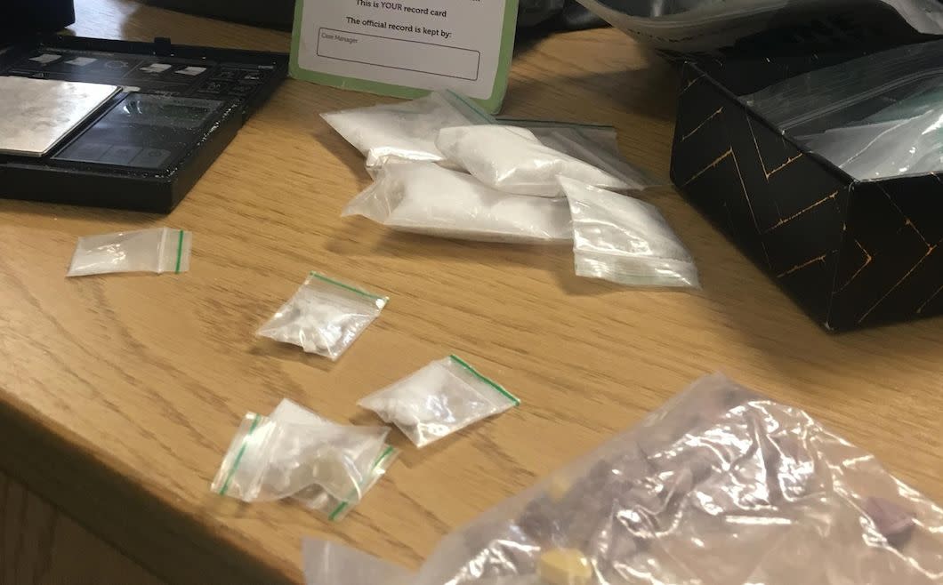 Police shared the picture of drugs found in a rucksack that someone left on a tram - along with their name and address (Picture: Facebook/Greater Manchester Police North Trafford)