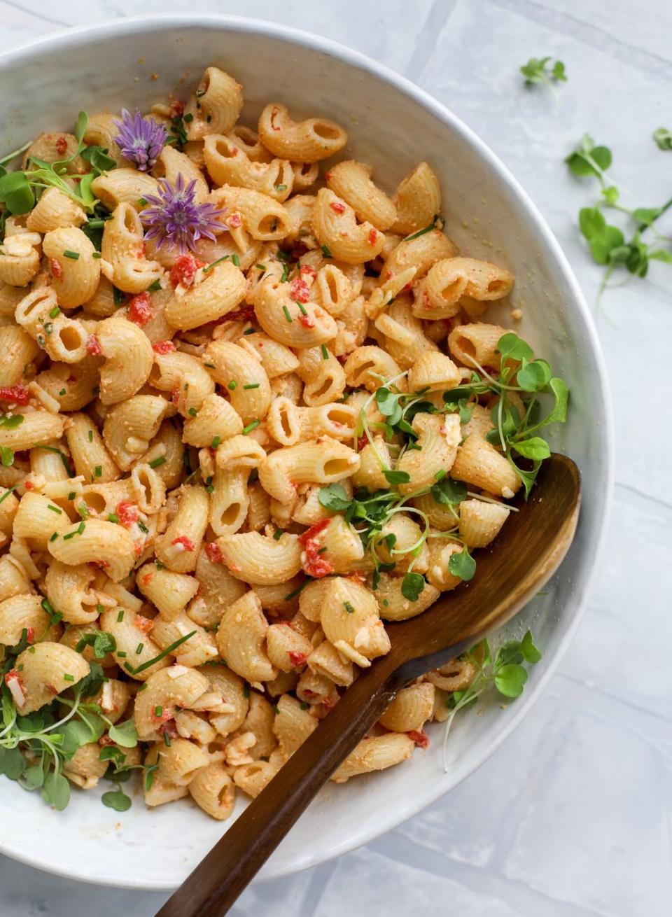 pimento cheese pasta salad with woooden spoon