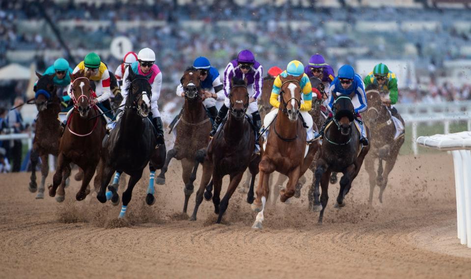 Derma Sotogake with jockey Christophe Lemaire leads horses into the first turn before winning Group 2 UAE Derby over 1900m (9.5 furlongs) at the Meydan racecourse in Dubai, United Arab Emirates, Saturday, March 25, 2023. (AP Photo/Martin Dokoupil)