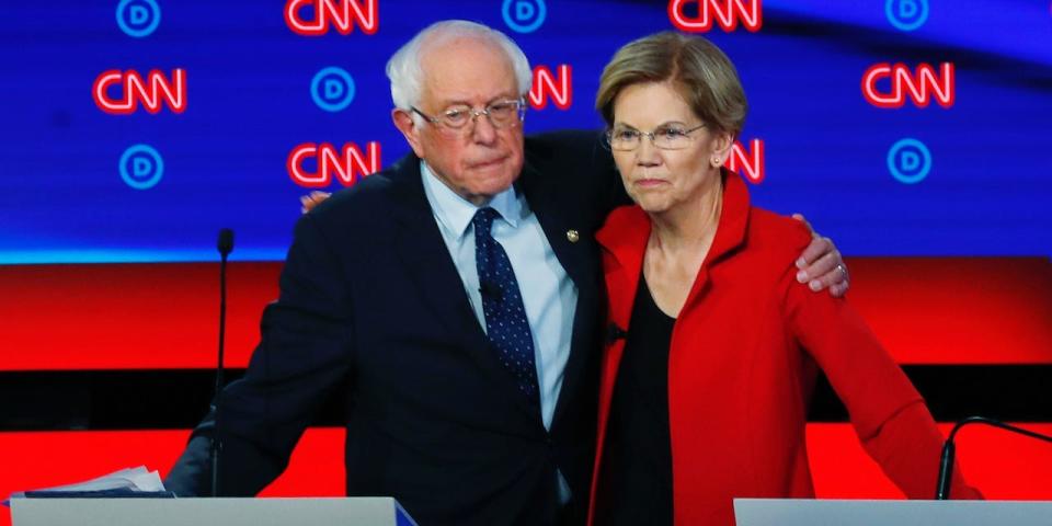 Sens. Bernie Sanders and Elizabeth Warren embrace at at July 2019 Democratic debate.