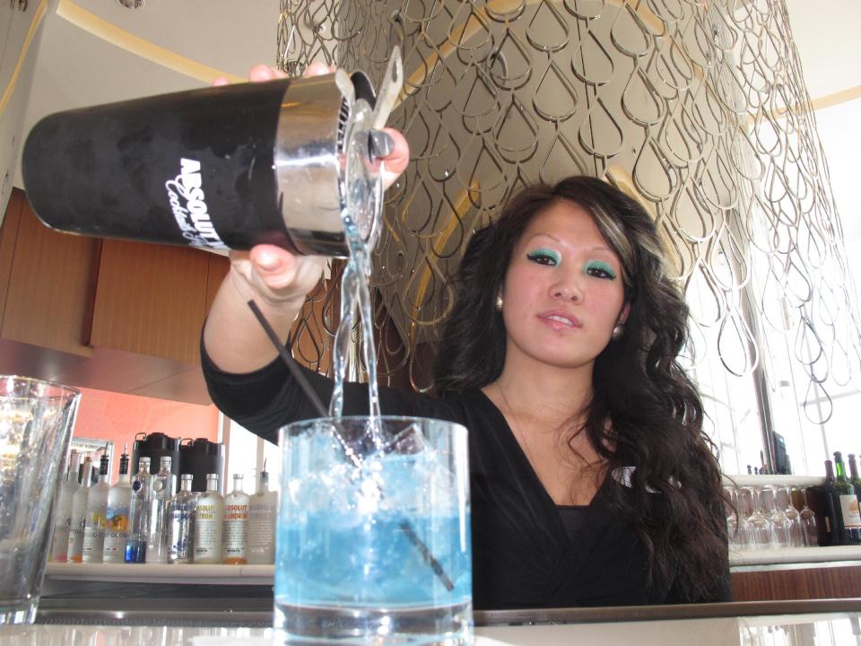 Mary Ma, a bartender at Revel in Atlantic City, N.J., pours a drink at one of the casino's bars Monday, April 8, 2013. Atlantic City officials unveiled a $20 million campaign on Tuesday, April 9, to attract more tourists to the seaside gambling resort. The campaign highlights the resort's food, drink, entertainment, gambling and relaxation offerings. (AP Photo/Wayne Parry)