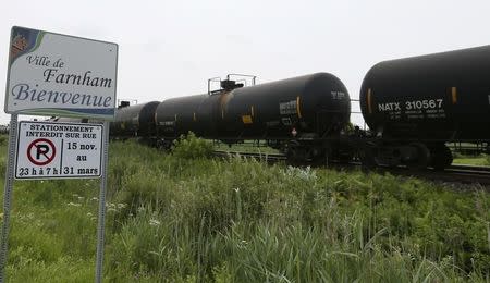 A freight car for crude oil sits outside the town of Farnham, Quebec, July 10, 2013. REUTERS/Christinne Muschi