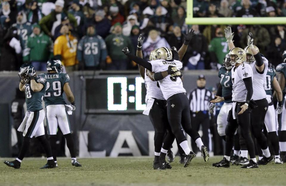 New Orleans Saints' Shayne Graham celebrates after kicking the game-winning field goal during the second half of an NFL wild-card playoff football game against the Philadelphia Eagles, Saturday, Jan. 4, 2014, in Philadelphia. The Saints won 26-24. (AP Photo/Julio Cortez)