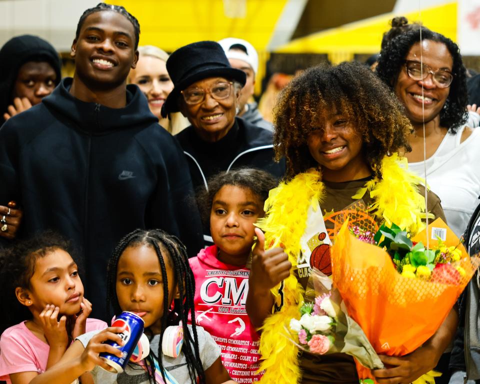 Jameelah Pharms poses with her extended family who came to support and celebrate her during senior night festivities at Stagg High School before their game against Cesar Chavez high in Stockton,CA