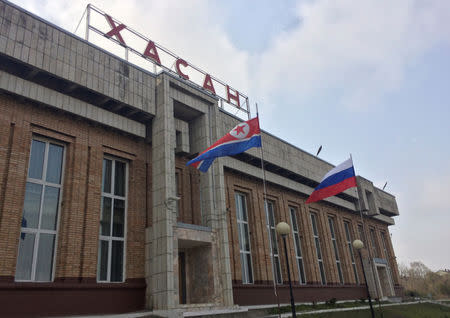 State flags of North Korea and Russia fly at a railway station near the border between the countries during preparations for a presumable visit of North Korean leader Kim Jong Un in the far eastern settlement of Khasan, Russia April 23, 2019. REUTERS/Stringer