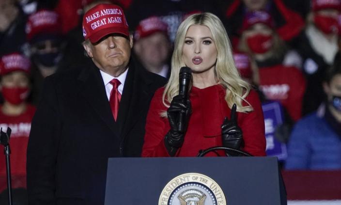 Ivanka Trump speaks at a campaign event while her father, Donald Trump, watches in Kenosha, Wisconsin.