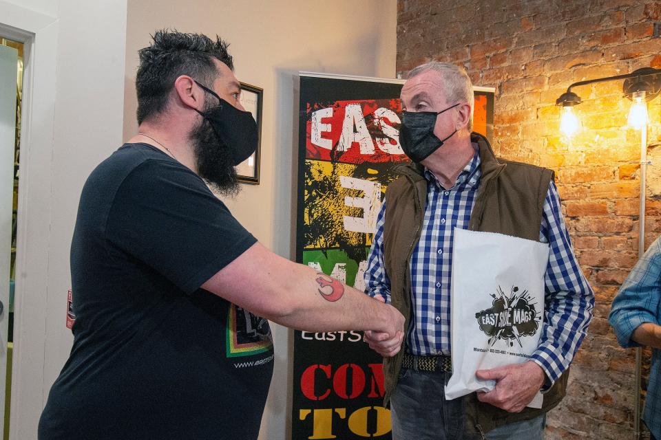 Governor Phil Murphy shakes hands with Jeff Beck, East Side Mags owner, as he visits East Side Mags during National Small Business Week to highlight $50 million for the Main Street Recovery Fund in Governor Murphyâ€™s budget proposal in Montclair, NJ Thursday, May 5, 2022. 