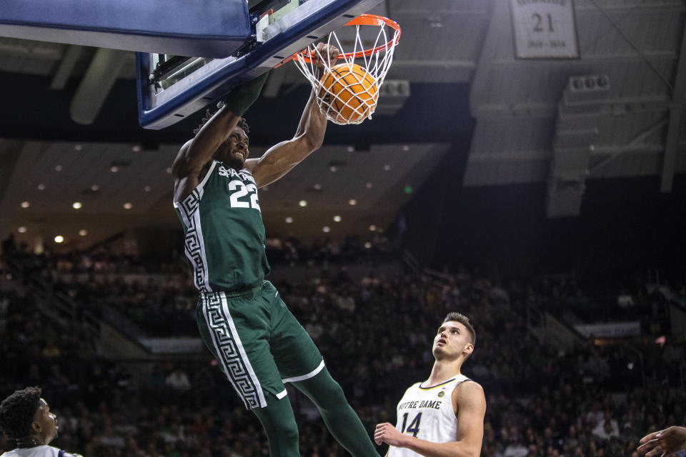 Michigan State's Mady Sissoko (22) dunks during the first half of the team's NCAA college basketball game against Notre Dame on Wednesday, Nov. 30, 2022, in South Bend, Ind. (AP Photo/Michael Caterina)