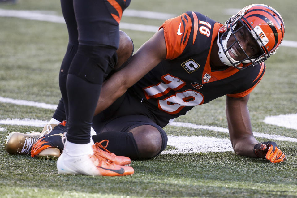 Cincinnati Bengals wide receiver A.J. Green (18) reacts after an apparent injury in the first half of an NFL football game against the Denver Broncos, Sunday, Dec. 2, 2018, in Cincinnati. (AP Photo/Frank Victores)