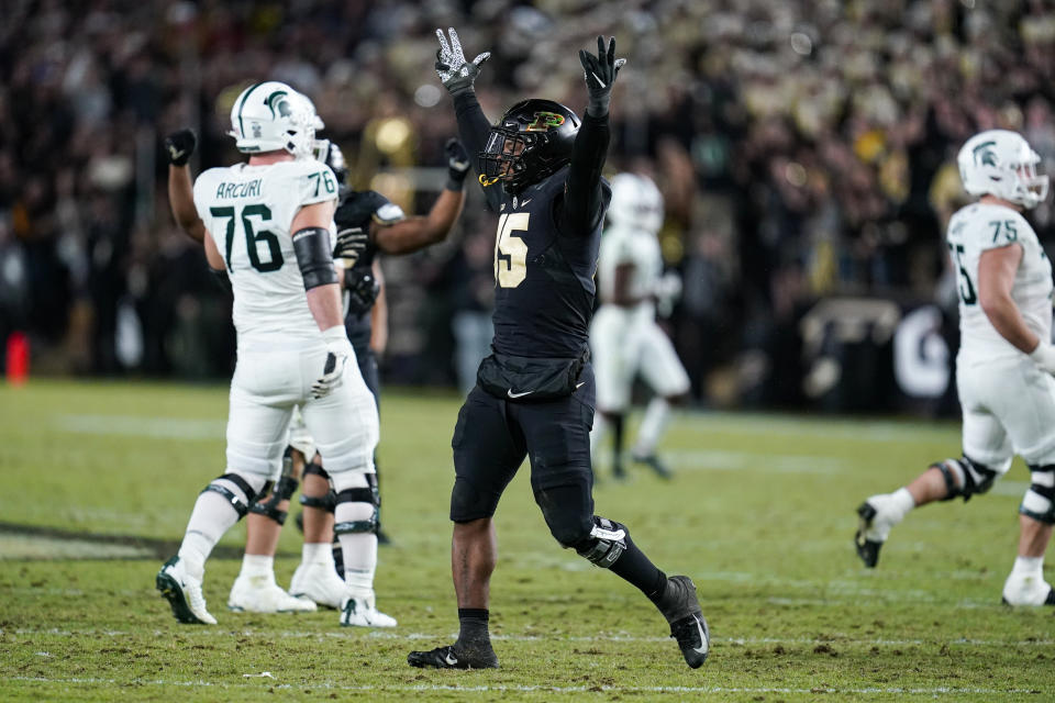 Purdue defensive end DaMarcus Mitchell (15) celebrates a sack during the second half of an NCAA college football game against Michigan State in West Lafayette, Ind., Saturday, Nov. 6, 2021. Purdue defeated Michigan State 40-29. (AP Photo/Michael Conroy)