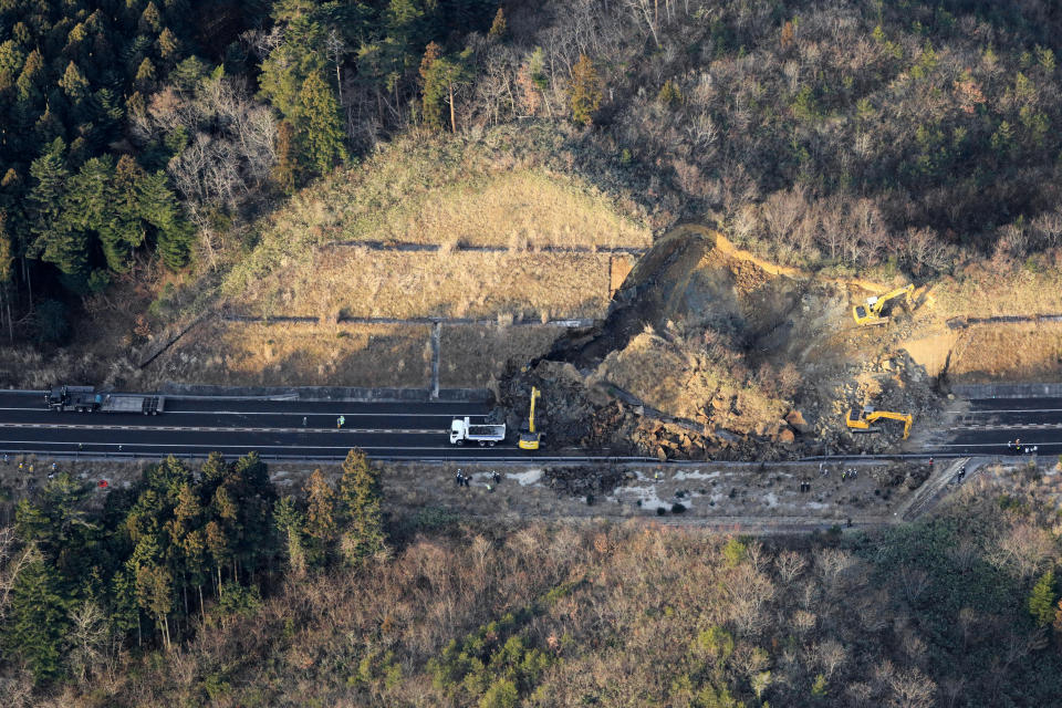 A portion of a highway is blocked by a landslide after an earthquake hit the city, in Soma, Fukushima prefecture, northeastern Japan, Sunday, Feb. 14, 2021. A strong earthquake hit off the coast of northeastern Japan late Saturday, shaking Fukushima, Miyagi and other areas, but there was no threat of a tsunami, officials said.(Hironori Asakawa/Kyodo News via AP)