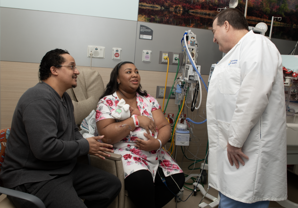 Billy and Tiffany Turner, both leap year babies, talk with Dr. James Monte on Friday at Summa Akron City Hospital. Tiffany holds Mya Marie, their second child who was born Thursday, which was leap day.