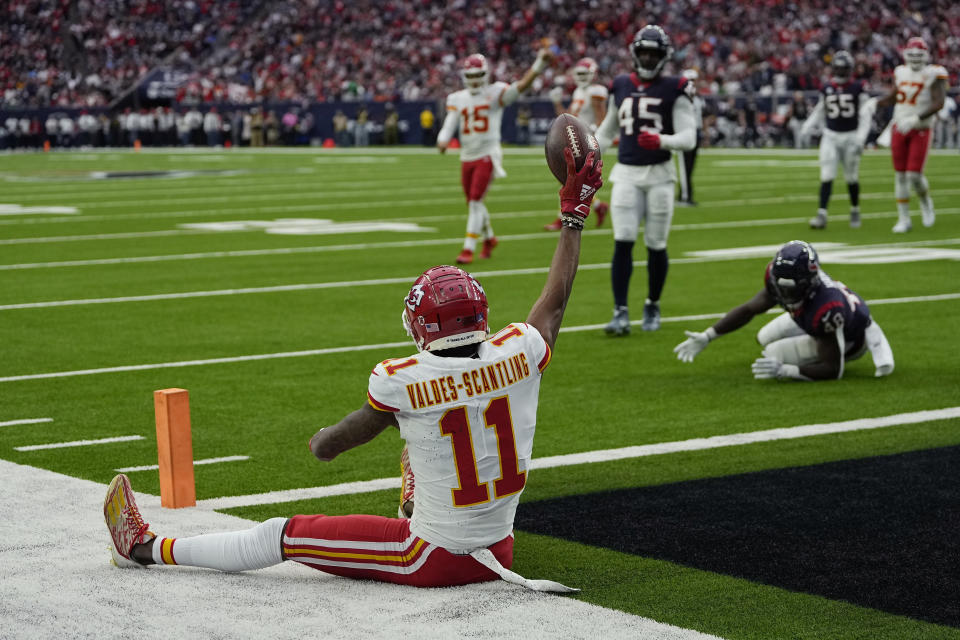 Kansas City Chiefs wide receiver Marquez Valdes-Scantling (11) celebrates his touchdown catch against the Houston Texans during the first half of an NFL football game Sunday, Dec. 18, 2022, in Houston. (AP Photo/David J. Phillip)