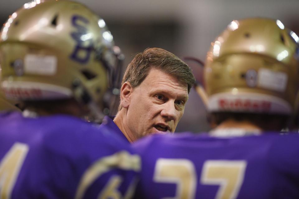 Sully Buttes' head coach Mark Senftner talks to the players during the game against Colome in the 9B Championships Friday, Nov. 9, at the DakotaDome in Vermillion.