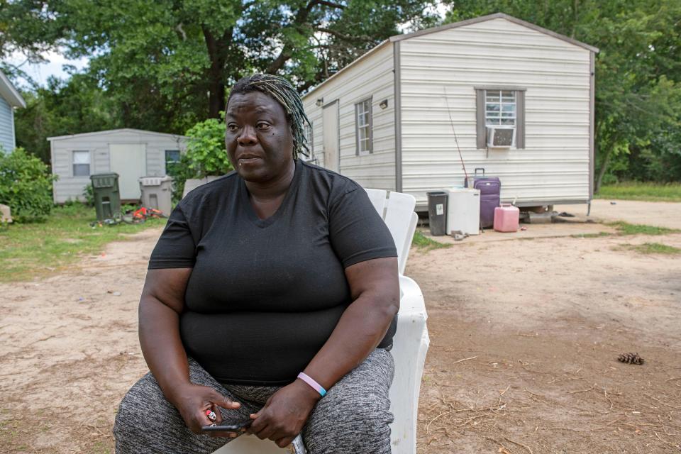 Ensley area resident Rena Crenshaw contemplates her future on Monday, May 15, 2023. Crenshaw recently discovered the one-bedroom trailer she is renting is on county-owned property and she is now facing eviction.